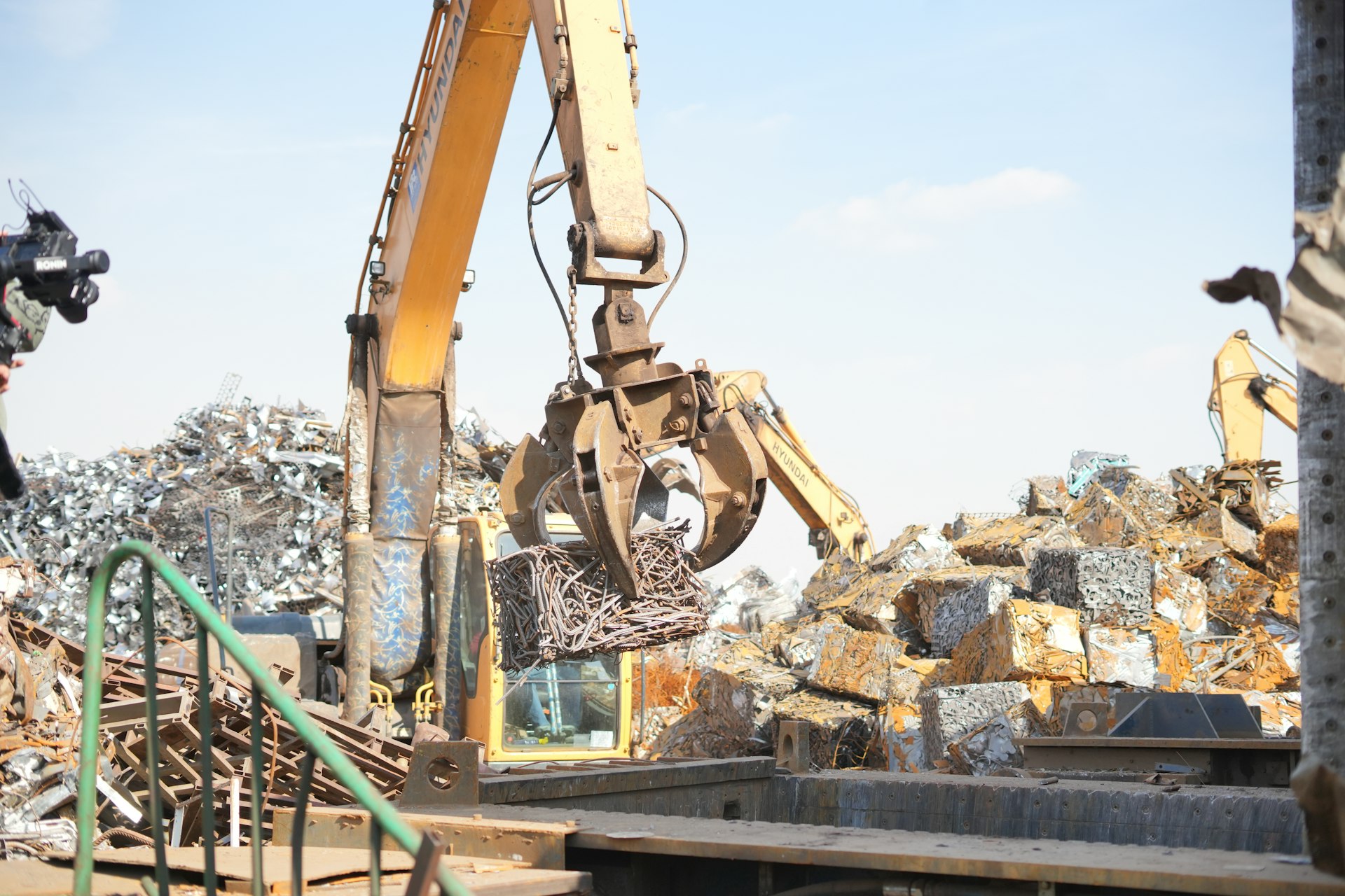 Excavator handling scrap at the Chakan yard